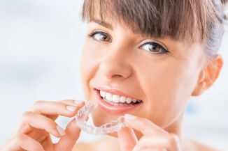 Patient preparing to wear clear aligners for smile correction
