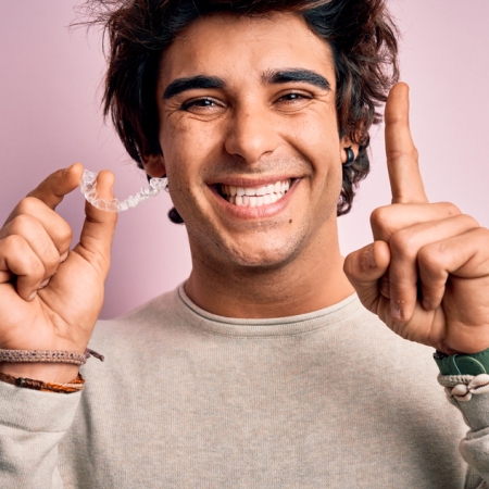 Patient showing confidence with clear aligner treatment
